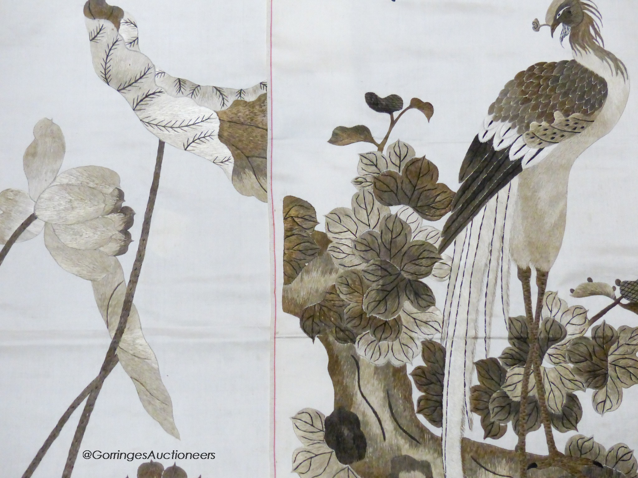 A pair of Chinese embroidered silk panels of birds amid flowers, circa 1900, 130 x 36cm